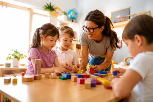 teacher with kids and blocks